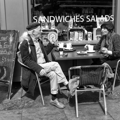 A couple having tea outside a shop, Notting Hill London black-and-white photography