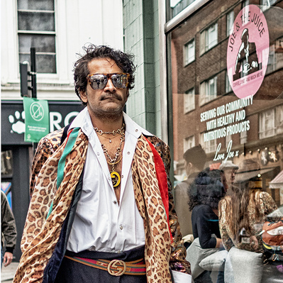 Cool guy walking down old Compton Street, Soho London colour photography