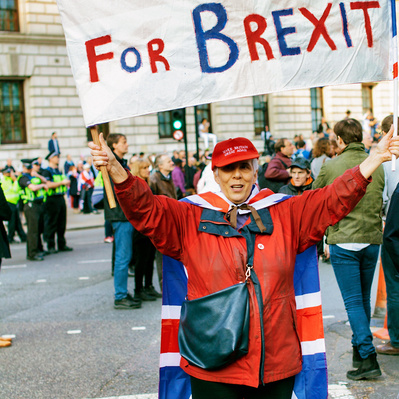 'Pro Brexit Protester holds up a banner, Westminster, London Colour Street Photography'