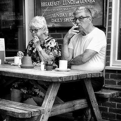 man and woman smoking, littlehampton Sussex black-and-white photography