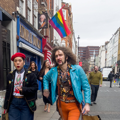 Man wearing a pair of flares Old Compton Street, Soho London colour photography