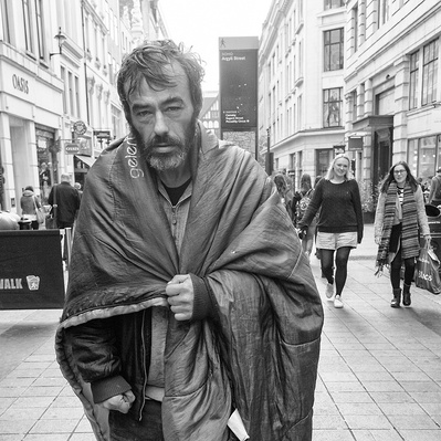 Rough sleeper with his sleeping bag, London black black-and-white photography