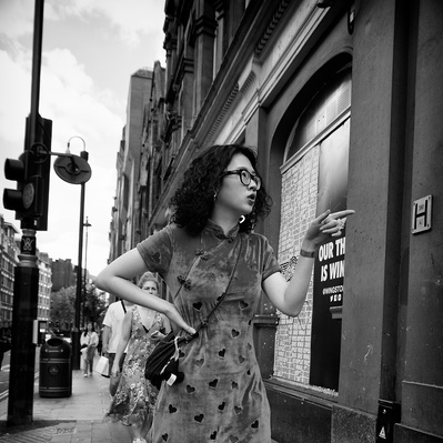 'A young woman pointing her finger, Black & White London Street Photography'