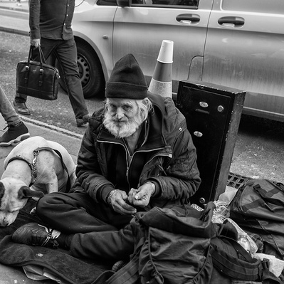 Rough sleeper with his dog London black-and-white photography