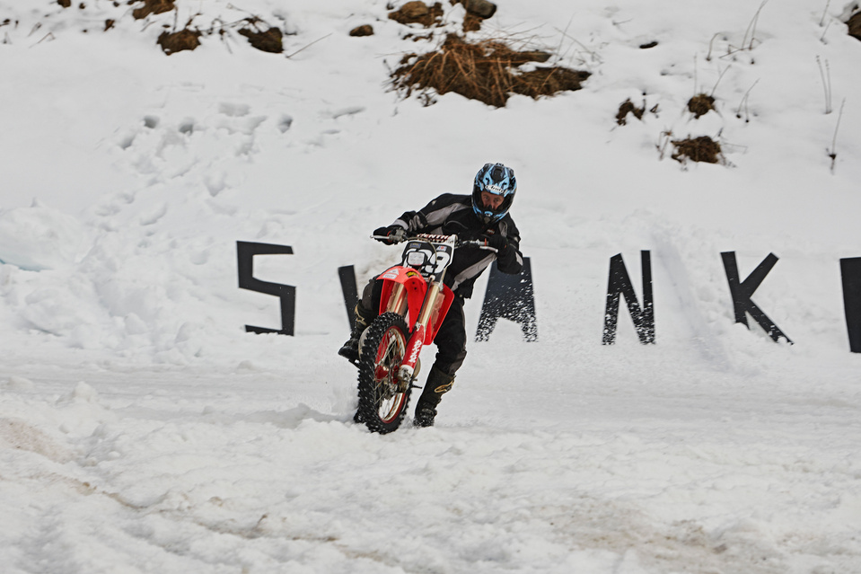 Honda CR 250 racing on an Icy Racetrack in Chamrousse, French Alps, during the Swank Rally on Ice organized by fashion brand Deus Ex Machina. 

