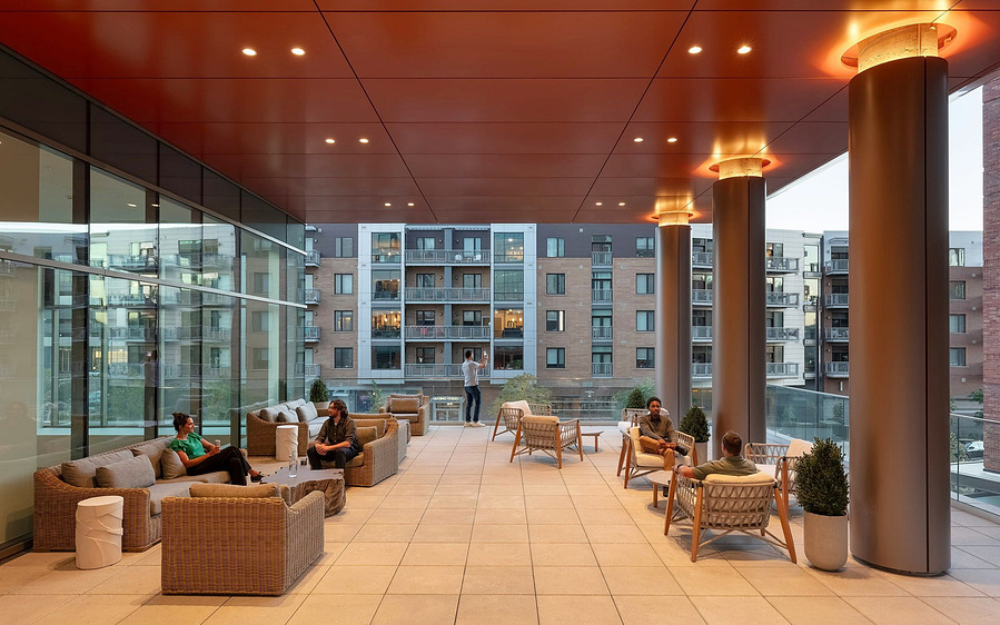 The terrace patio at Kimpton Claret Hotel in Denver, offering views of the city in a stylish outdoor space.