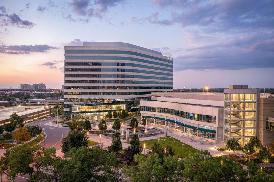 Office building and courtyard aerial view at twilight.