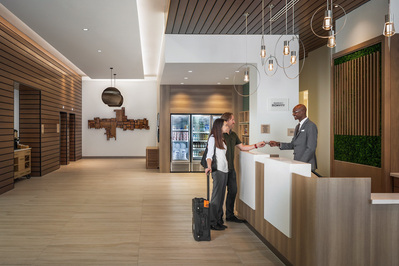 Guest Check-in lifestyle interior of the Element Marriott Denver lobby, showcasing the vibrant and contemporary atmosphere.