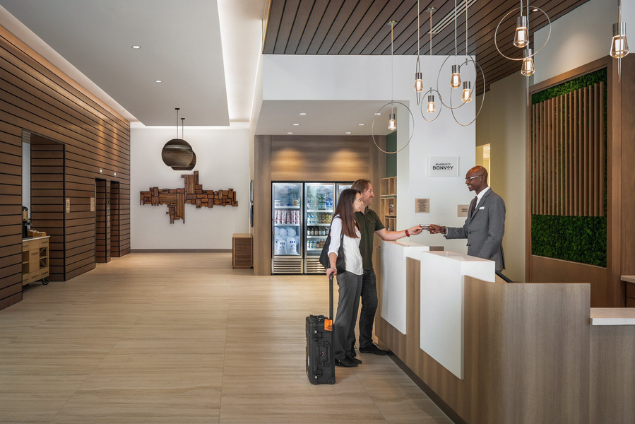 Guest Check-in lifestyle interior of the Element Marriott Denver lobby, showcasing the vibrant and contemporary atmosphere.
