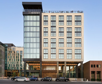 Exterior at dusk of Le Meridien Salt Lake City, showcasing the hotel’s sleek design as the lights begin to glow at twilight.