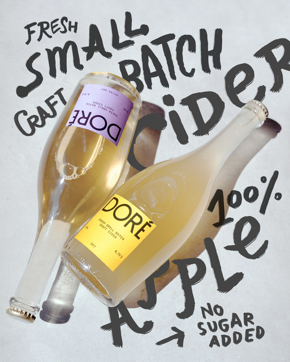 Product photo for Doré Cider, featuring bottles in a minimalist setting under vibrant sunlight. A crisp, natural aesthetic reflecting the essence of premium cider.