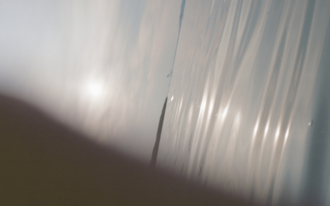 Film photograph of the weary late-summer sunlight over Lake Balaton, evoking tranquil, nostalgic warmth.