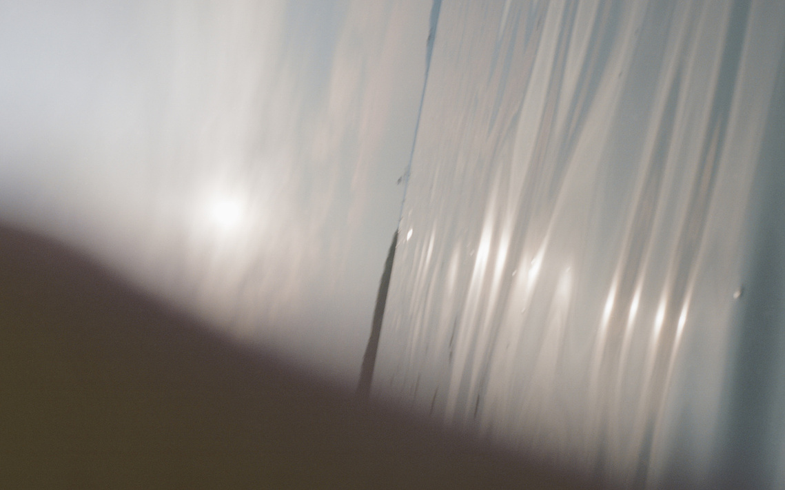 Film photograph of the weary late-summer sunlight over Lake Balaton, evoking tranquil, nostalgic warmth.