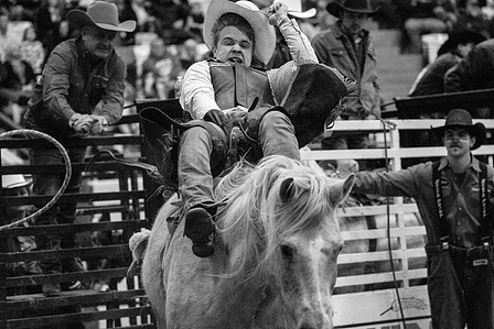 Haustin Hawkins from Bremen, Ky. holds on during the bareback bronc riding competition at 70th annual Lone Star Rodeo in Bowling Green, Ky. “I’m an adrenaline junkie,” Hawkins said about his desire to participate in rodeos. The three day event is put on b