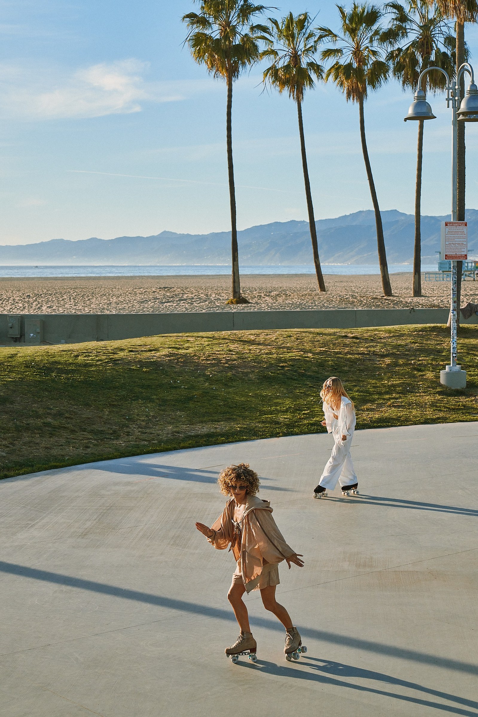 Roller skating in Venice Beach Los Angeles California for a photo shoot fashion brand campaign for Brunello Cucinelli