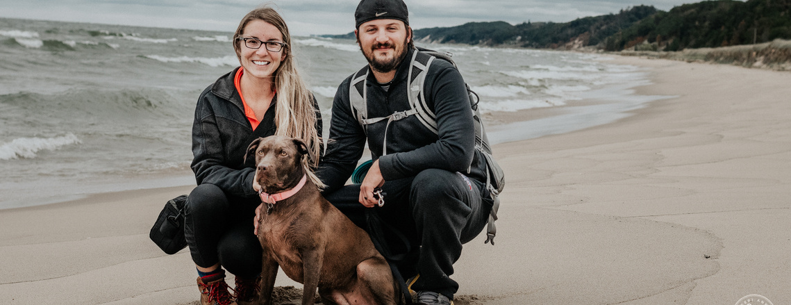 Family portrait of photographer, Keri and her family on Lake Michigan
