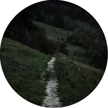 Chalk pathway leading into a landscape at night.
