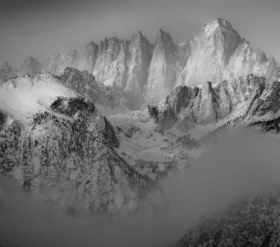Mount Whitney makes brief apperance during winter storm in the Sierra Nevada, California.