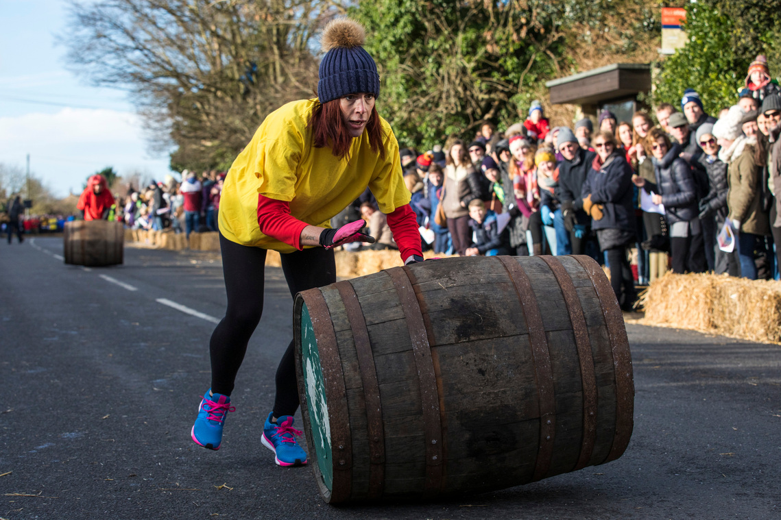 The annual Boxing Day barrel rolling relay race in Grantchester, Cambridgeshire. 