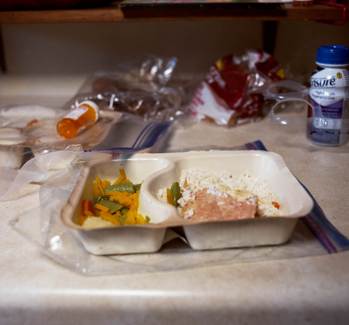 Remains of a Meals on Wheels dinner in its container; part of a series on Medical Assistance in Dying
