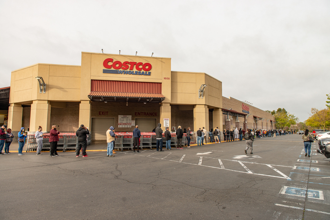 Costco March 28, 2020 Lines wrap around Costco building as customers await for the store to open.