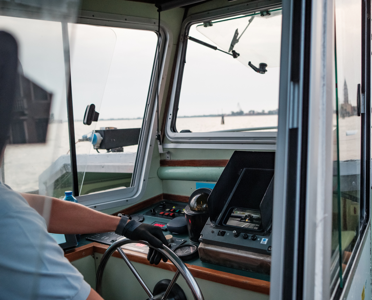 Cockpit view of Venetian Vaporetto driver, Italy