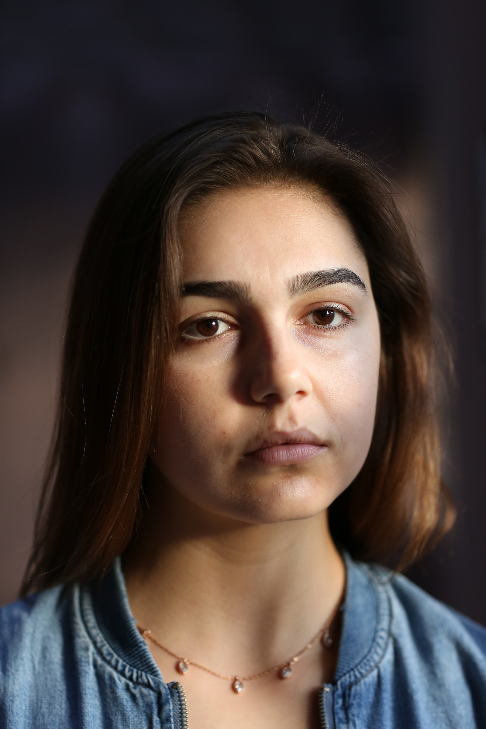 Former Biological Resource Center intern Emily Glynn, 24, poses for a portrait at the Arizona State University Art Museum in Tempe, Arizona December 17, 2017. “Over the course of the internship, I stripped subcutaneous fat from the vertebrae of a cervical