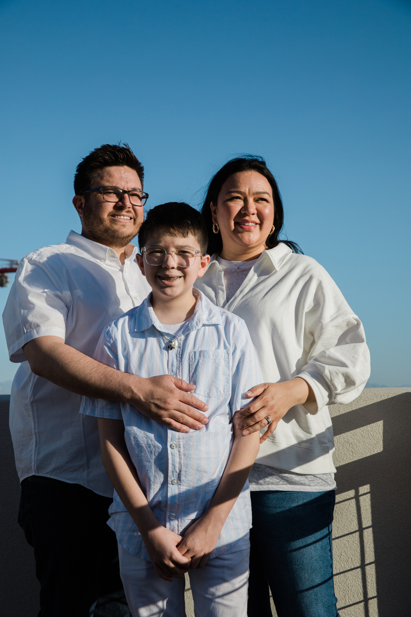 Daniel Trujillo with his parents Lizette and José at their home on May 24 in Tucson, Ariz.
