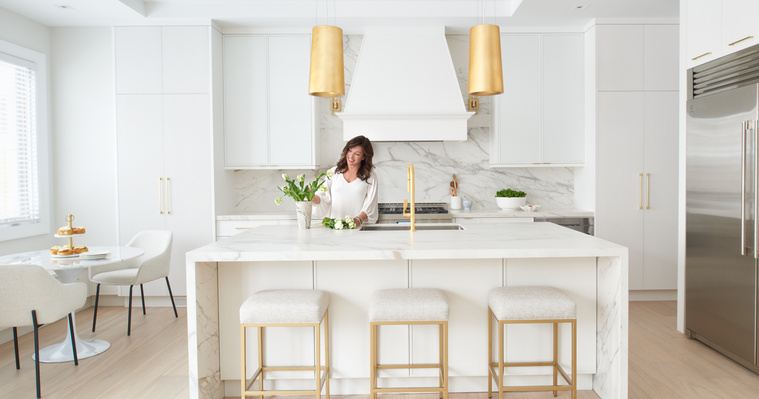 Interior Designer Kathlyn Shaw poses in the kitchen of her custom home build project photographed in Etobicoke, ON. 