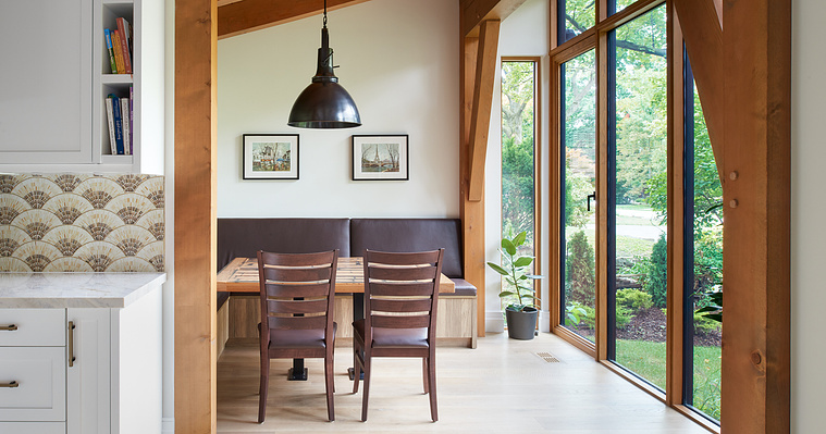 Breakfast nook in timber beam home with interior design by Dochia Interior Design in Mississauga. 