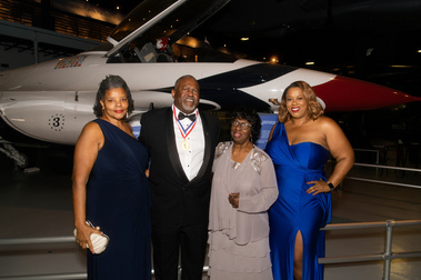 Group of guests in formalwear at a black-tie awards gala