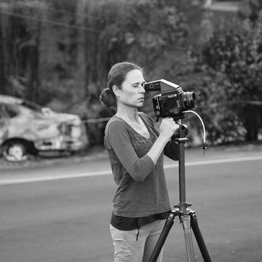 Portrait of artist Laura Resen hard at work behind a Mamiya RZ film camera photographing the Sonoma Napa Tubbs fires for her project HomeFires.  Photo by her daughter.