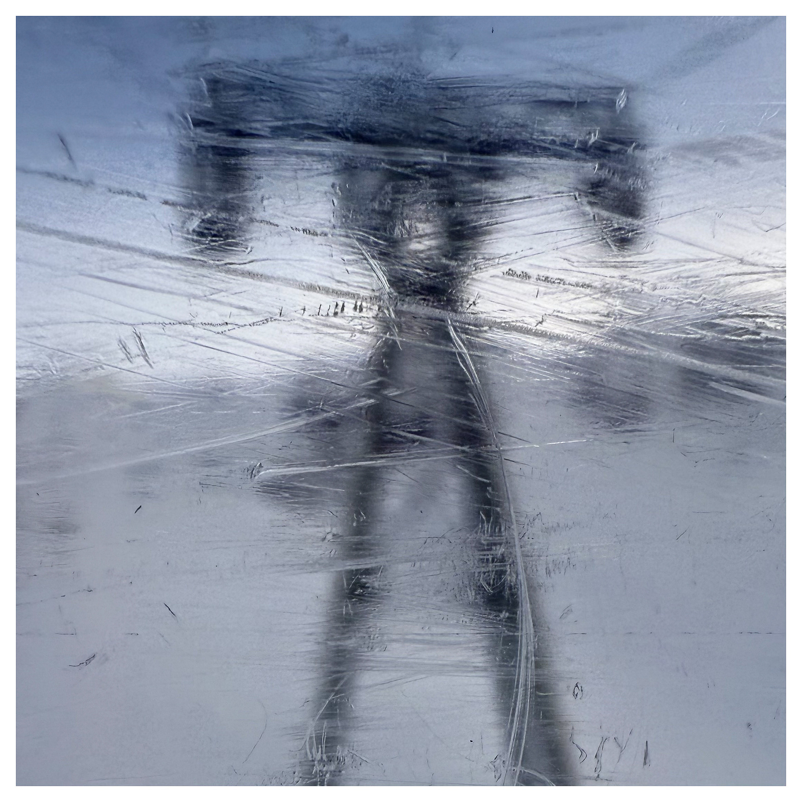 An electricity pylon appears to look like a robotic character through a frosted cable car window