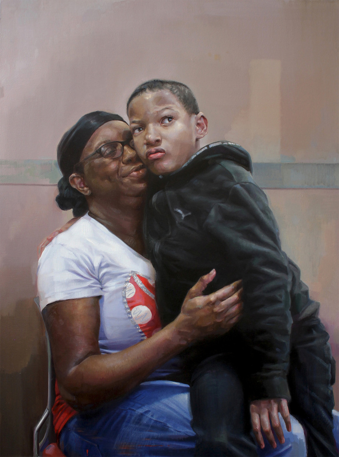 Black mother embrasing her son who has a disability