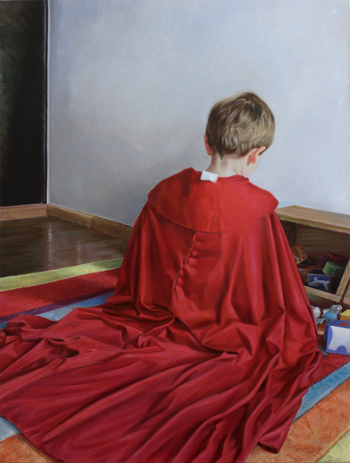 kneeling boy with a red cape