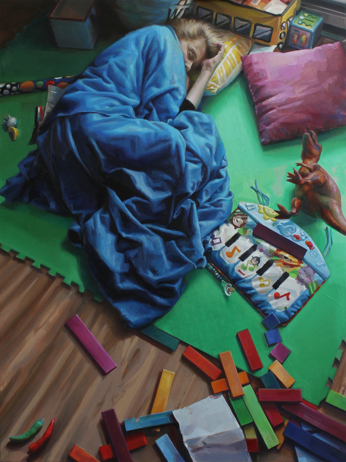 tired mother on the floor with a lot of toys around
