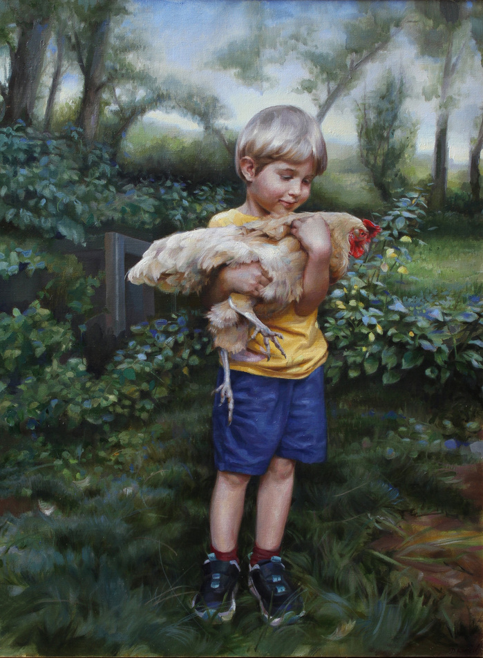 Boy holding a rooster outside