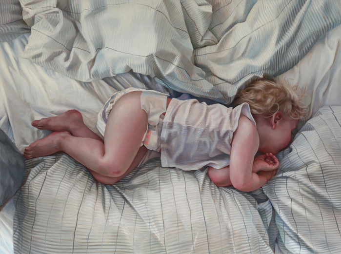 child in a white bed