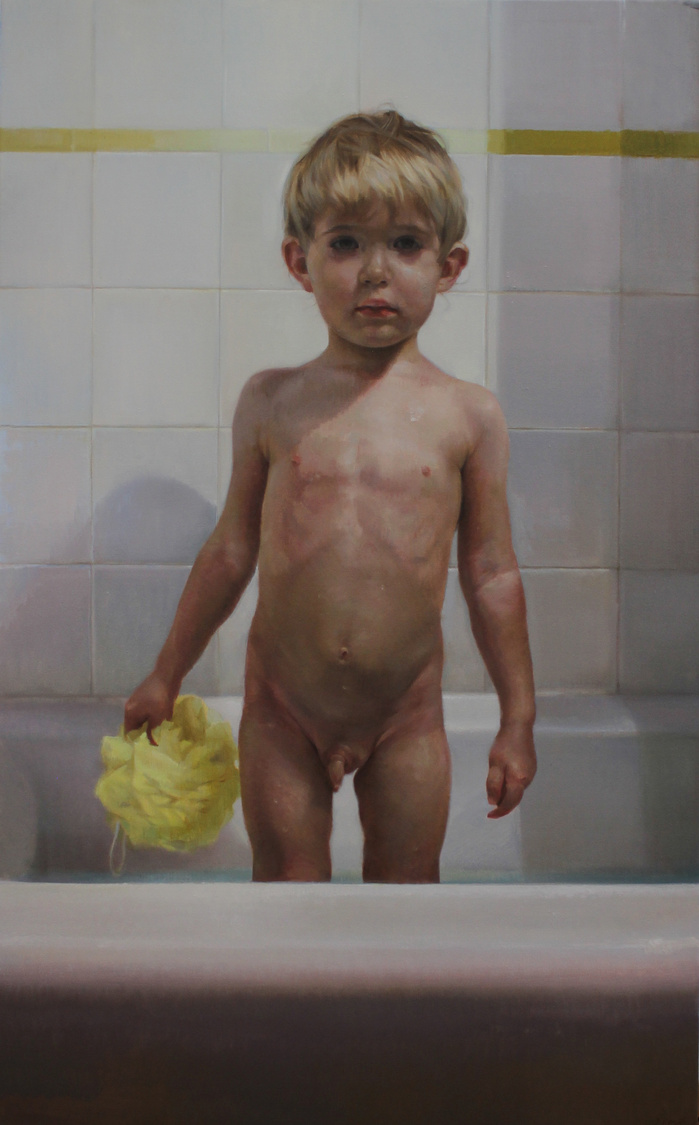 Boy in the buthtub with yellow luffa