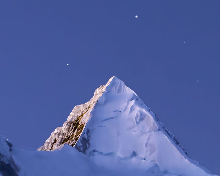 A high altitude morning dawn at Alpamayo, Cordillera Blanca, Peru.
