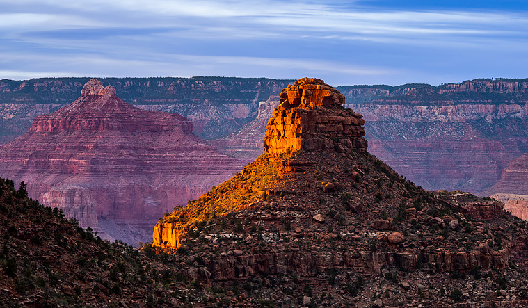 The last beam of light on a Grand Canyon butte.