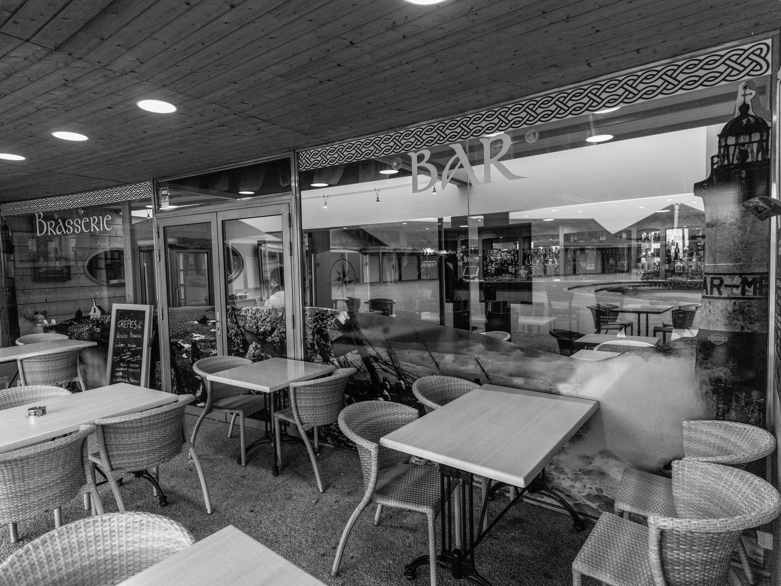 It is a rainy , windy day: nobody on the terrace