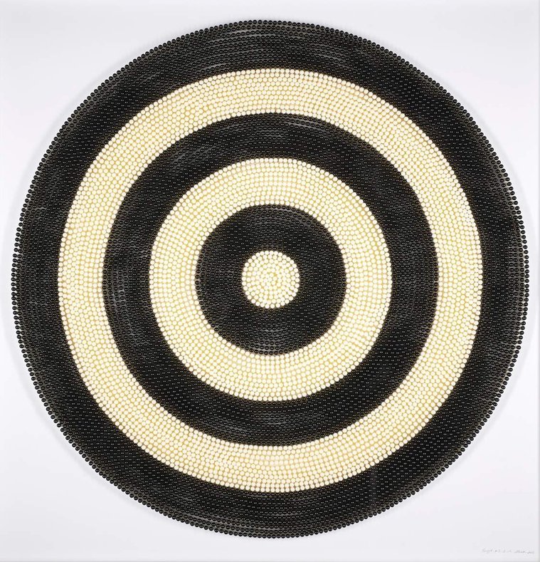 Target #3, an artwork by Tasmanian contemporary artist Di Allison, HALLISON Studios, Tasmania, online gallery, using empty pill capsules in white and black to form a large circular target, Pop Art like.