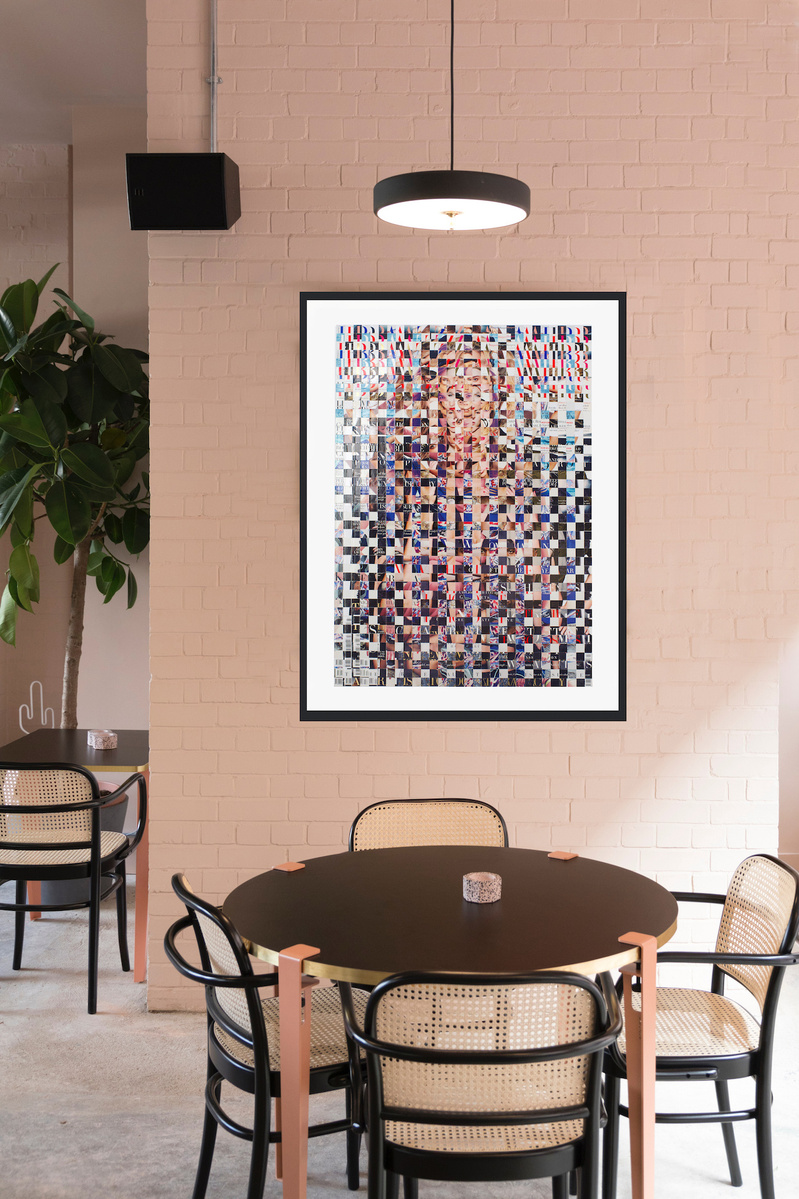 In-situ art in a cafe dining setting. Fake Muse #3 is a large collage by Tasmanian contemporary visual artist Diane Allison, HALLISON Studios made of hand cut squares of Harpers Bazaar fashion magazines which form a large up scaled magazine cover.