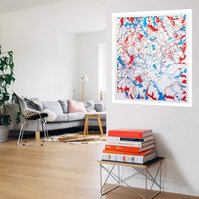 Contemporary art in-situ in sunny living room, grey sofa, white walls. Body of Water by artist Di Allison HALLISON Studios.Tasmanian rivers as cut paper of blue & red, white background. Suggests body's circulatory system. Glover Art Prize finalist