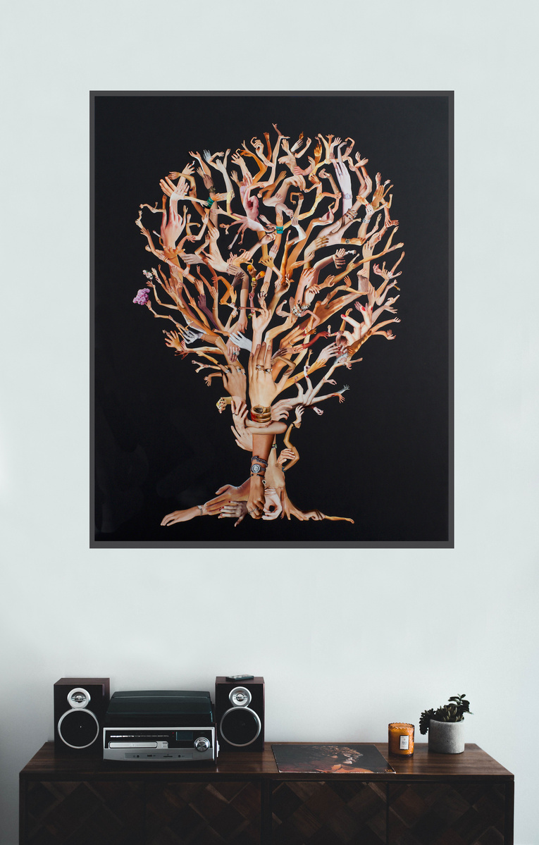 Art in-situ with record player. Hand Hold a large contemporary art collage by Tasmanian visual artist Diane Allison HALLISON Studios, hands & arms from fashion magazines Vogue Harpers Bazaar Elle Marie Claire Net-a-Porter, form a tree on black background.
