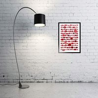 In-situ art on white brick wall, black lamp. Speechless, contemporary art work of red lips from fashion magazines Vogue, Elle, Harpers Bazaar and Net-a-Porter.  Pinned in rows like specimens, white background, by Diane Allison, HALLISON Studios, Tasmania.