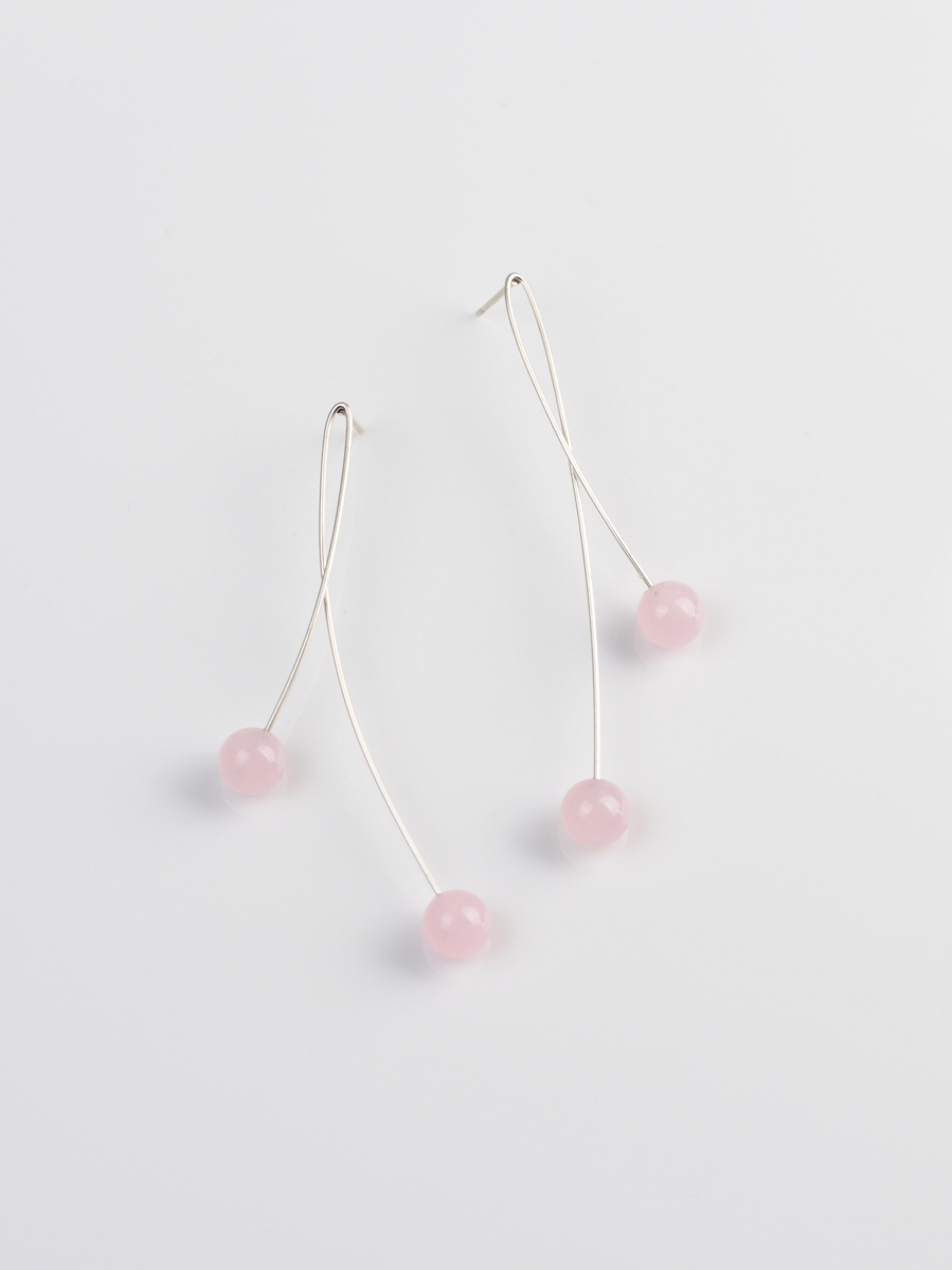 Elegant contemporary long stemmed earrings of sterling silver and pink gemstones inspired by the slender organic forms of the Button Grass plains of the Highlands of Central Tasmania by jeweller Di Allison, HALLISON Studios, entitled Highlands: Loop.