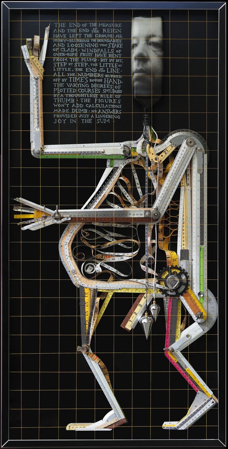 The Ruler by contemporary artist Patrick Hall, HALLISON Studios, Tasmania, online gallery, is a sculptural figure, a man made of vintage rulers, measuring tools, protractors, plumb bob, levels, compass, with a spirit bottle as a head and face.