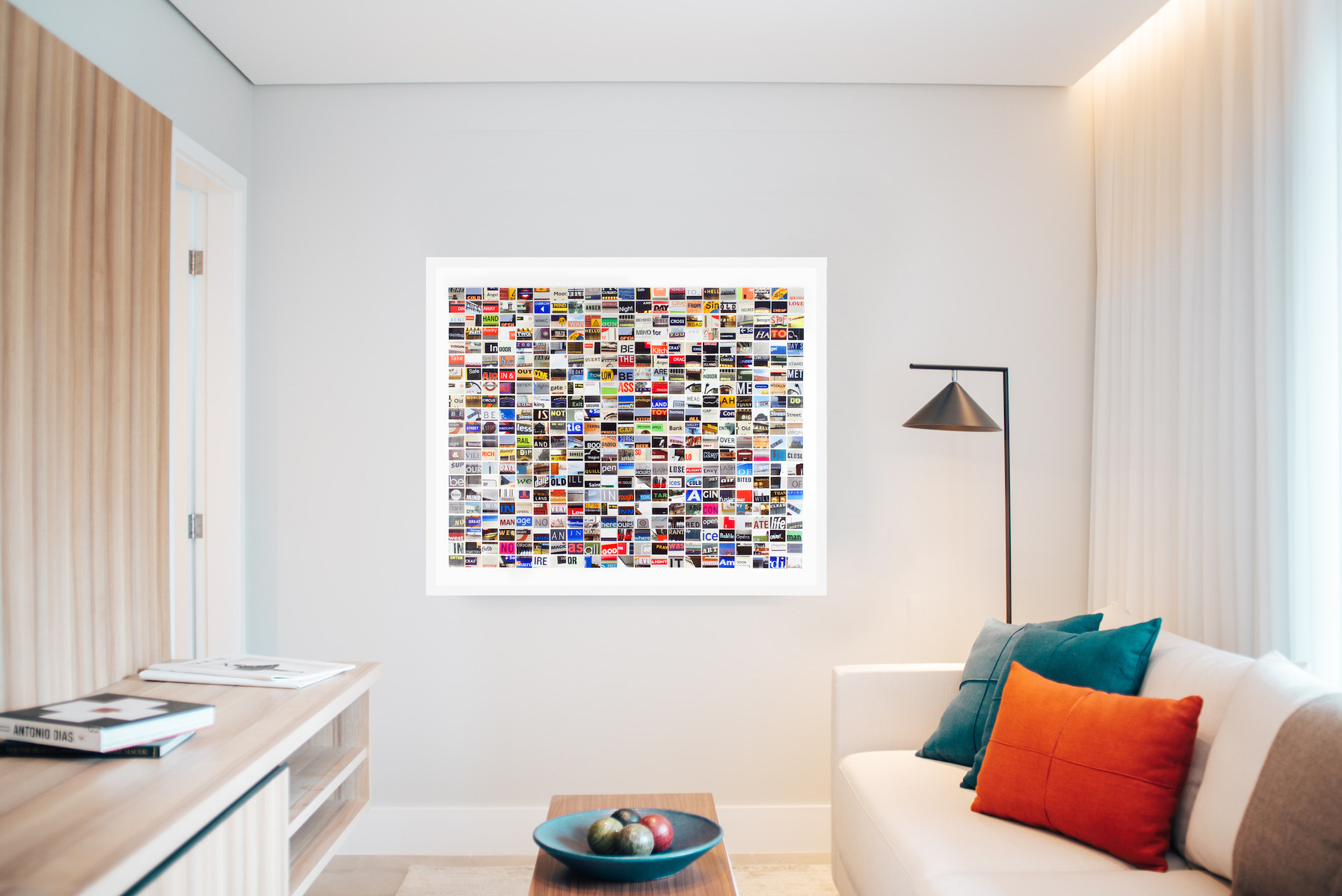 In-situ contemporary art in a living room. Lone Cold Angel - grid of small hand cut photos of street signage words by visual artist Diane Allison HALLISON Studios Tasmania.  Colourful grid of words is a type of narrative, concrete poetry, poem, prose.